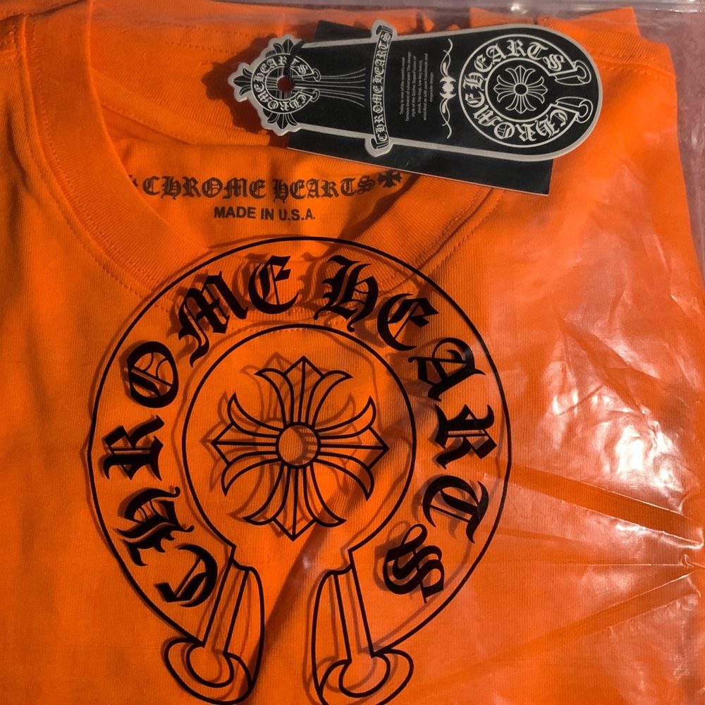 Chrome Hearts T-shirt, orange with design on chest and throughout the back